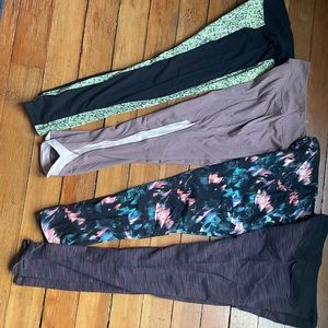 Four pairs of medium athletic pants.